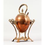 A 19TH CENTURY COPPER KETTLE/SAMOVAR ON STAND. 17ins high.