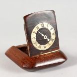 A SUPERB SMALL PIECE OF TREEN, A WOODEN SNUFF BOX, the lid inset with a clock face. 2.5ins x 2.