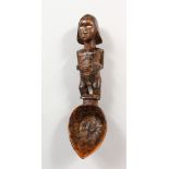 A TRIBAL FIGURAL SPOON. 10ins long.