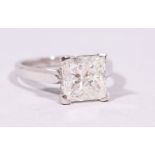 AN 18CT WHITE GOLD IMPRESSIVE PRINCESS CUT DIAMOND RING of 3.18cts.