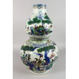 A LARGE CHINESE PORCELAIN DOUBLE GOURD VASE, painted with figures seated at a table in a