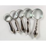 FIVE VARIOUS SILVER PLATE MAGNIFYING GLASSES.