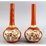 A PAIR OF JAPANESE MEIJI PERIOD KUTANI PORCELAINN BOTTLE VASES, 23CM.