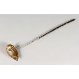 A CONTINENTAL SILVER TODDY LADLE, with shell shape bowl and twisted horn handle. 16.5ins long.