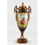 A SINGLE SEVRES DEEP BLUE TWO-HANDLED VASE AND COVER, painted with a reverse scene of young lovers
