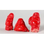 THREE SMALL CARVED CORAL FIGURES OF MEN. 2ins high.