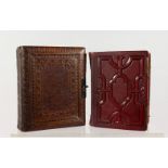 TWO VICTORIAN EMBOSSED LEATHER PHOTOGRAPH ALBUMS. 6.5ins x 5.5ins and 6ins x 4.5ins.