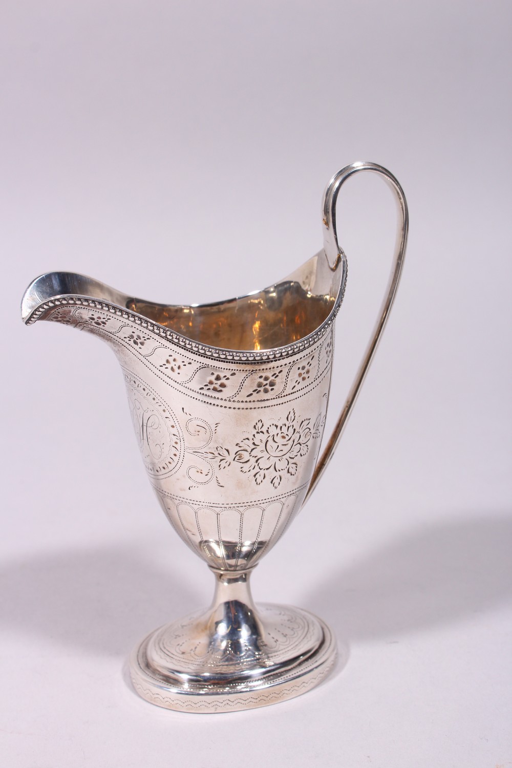 A GOOD GEORGE III ENGRAVED HELMET SHAPED MILK JUG, with reeded handle and base. London 1782. - Image 4 of 9