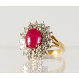 A GOOD RUBY AND DIAMOND OVAL CLUSTER RING, set in yellow gold.