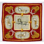 A HERMES SILK SCARF, HORSE, in an orange box.