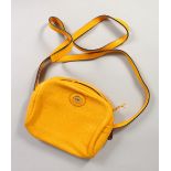 A CHRISTIAN DIOR YELLOW LEATHER SHOULDER BAG AND STRAP, in a Christian Dior bag.