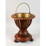 AN EARLY 20TH CENTURY DUTCH MAHOGANY JARDINIERE, with brass liner and handle. 1ft 4ins high.