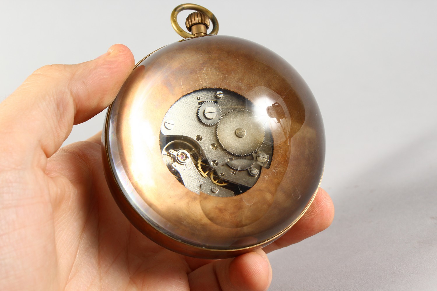 A LARGE OMEGA STYLE GLASS BALL WATCH, with open face and movement. 3ins diameter. - Image 3 of 3