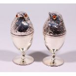 A PAIR OF PLATE CHICK EGG CUPS AND COVERS.