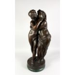 A LARGE BRONZE CLASSICAL GROUP, modelled as embracing lovers, on a circular marble base. 33ins