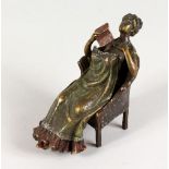 A VIENNA STYLE COLD PAINTED BRONZE, of a lady seated on a chair. 5ins long.