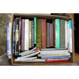 A box of art and antique related reference books.