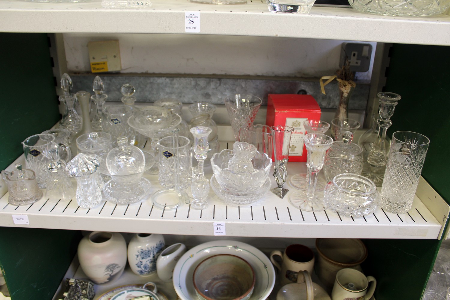 A quantity of cut glass vases and other items.