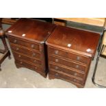 A pair of small mahogany chest of drawers.