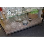 A shelf of assorted glassware.