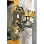 A pair of Gothic style wrought and brass wall lights.