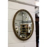 A gilt framed mirror.