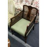 A Bergere style armchair.