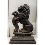 A Victorian cast iron door stop "Lion Rampant".