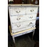 A painted chest of drawers and a two drawer table.