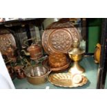 A quantity of copper and brassware to include a kettle on stand.