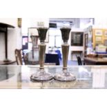 A pair of modern silver candlesticks.