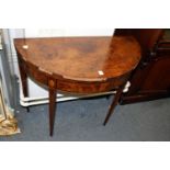 A George III mahogany D-shaped foldover card table.