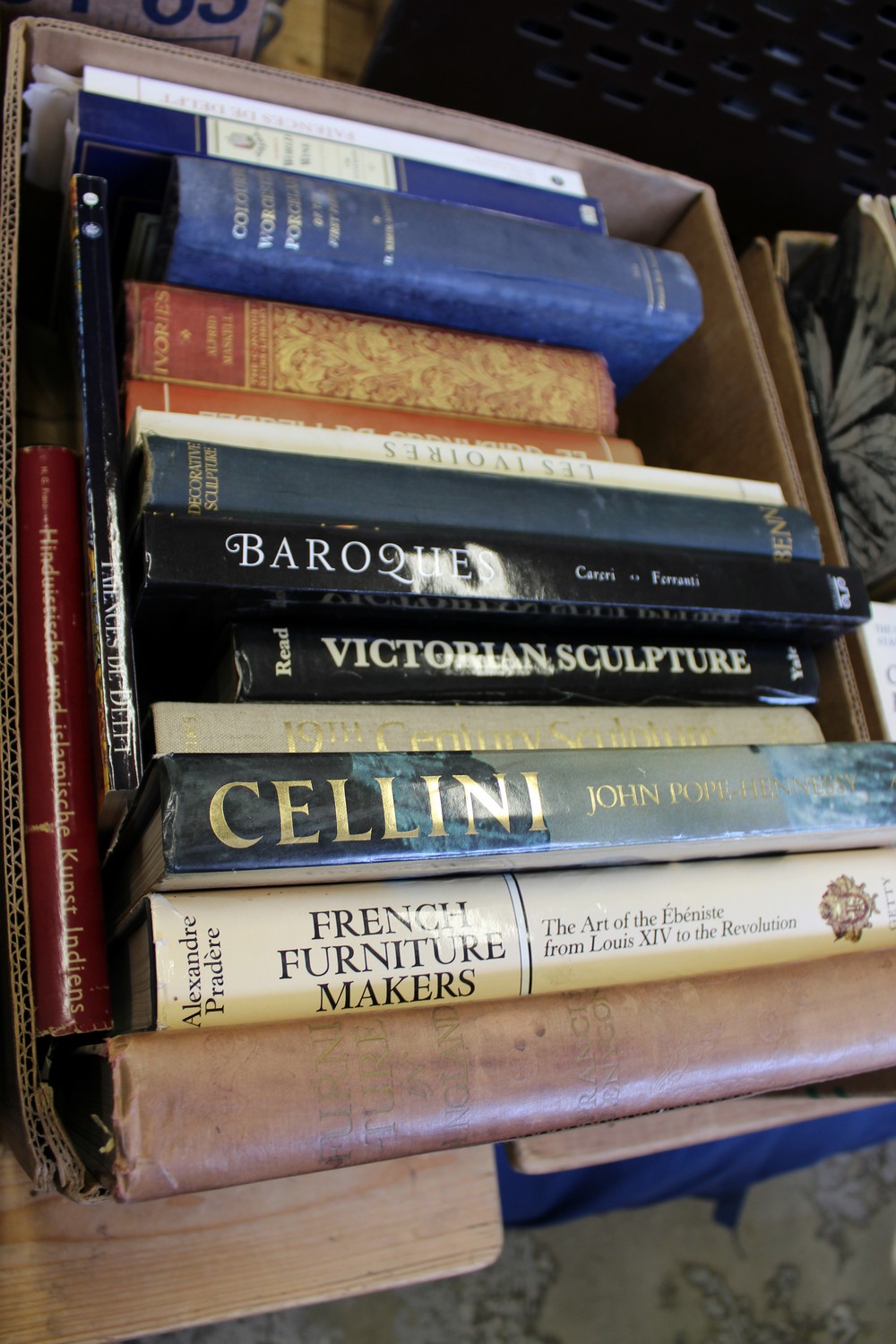 A box of art and antique related reference books.