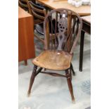 An ash and elm wheel back dining chair.