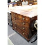 A George III mahogany straight front chest of two short and three graduated long drawers on