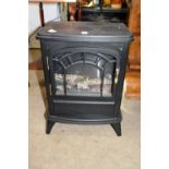 A small log effect electric stove.