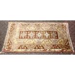 20th century Persian carpet, beige ground with stylized motifs. 8ft 0ins x 4ft 5ins.