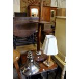 An Art Deco walnut and chrome standard lamp and a similar table lamp.