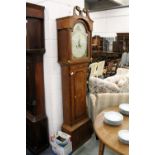 A 19th century oak and mahogany long case clock with painted arched dial.