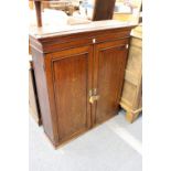 A 19th century oak two door hanging cupboard.