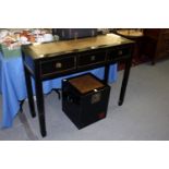 A Korean style ebonised three drawer altar table with woven style inset top.