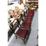 A set of six William IV mahogany kidney back dining chairs with drop-in seats on baluster shaped