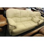A cream leather three seater settee.