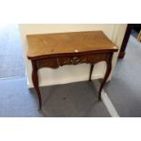 A French style ormolu mounted mahogany serpentine fronted foldover card table.
