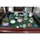 A collection of glass paperweights and ornaments.