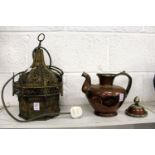 An eastern pierced brass lantern and an eastern copper ewer.
