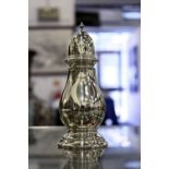 A silver pedestal baluster shaped sugar caster.