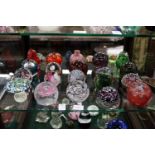 A good collection of glass paperweights.