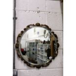 A circular wall mirror.