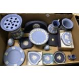 A quantity of Wedgwood blue Jasper ware items to include vases, jugs, table clock etc.